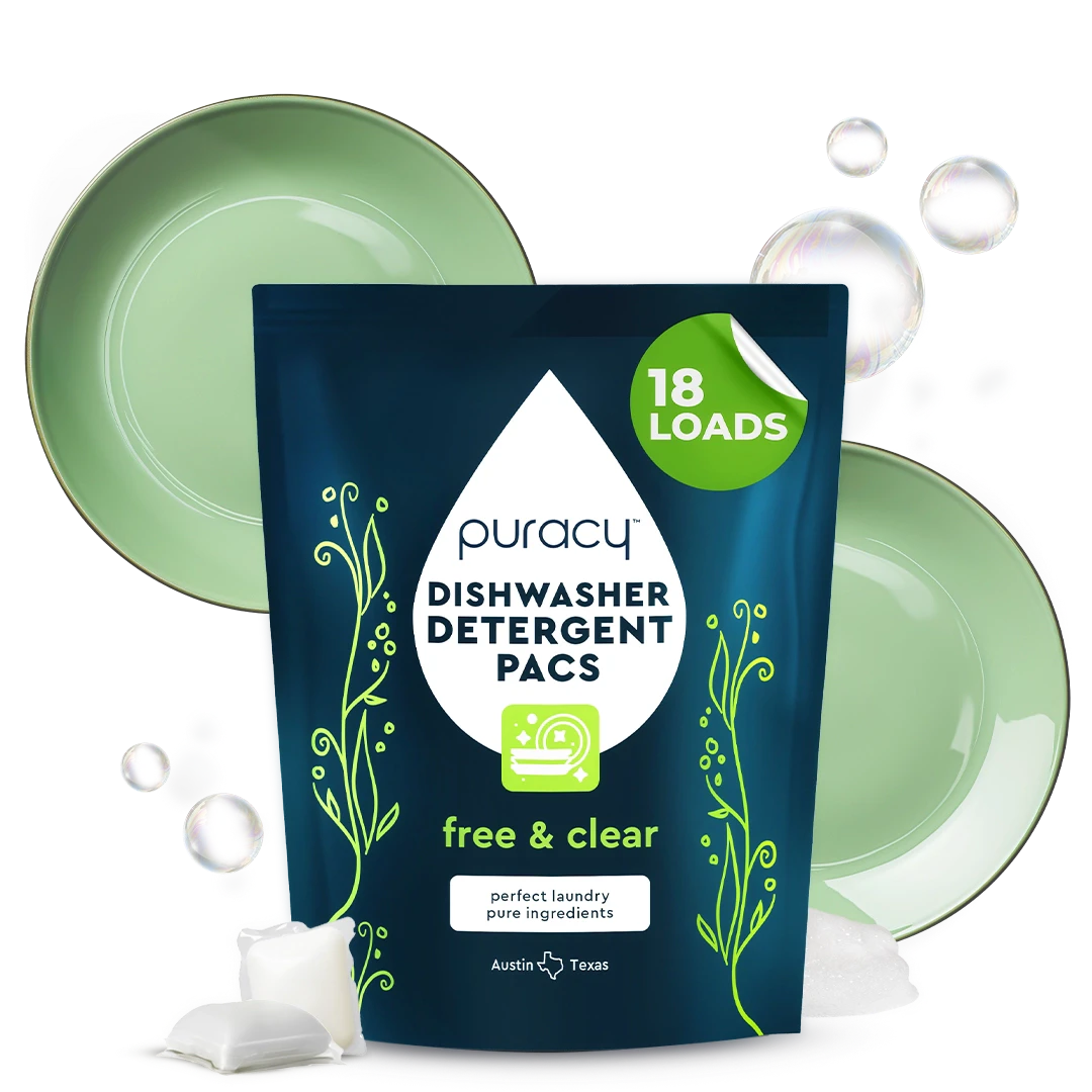 Plant-based Dishwasher Detergent Pods with bubbles, green plates backdrop.