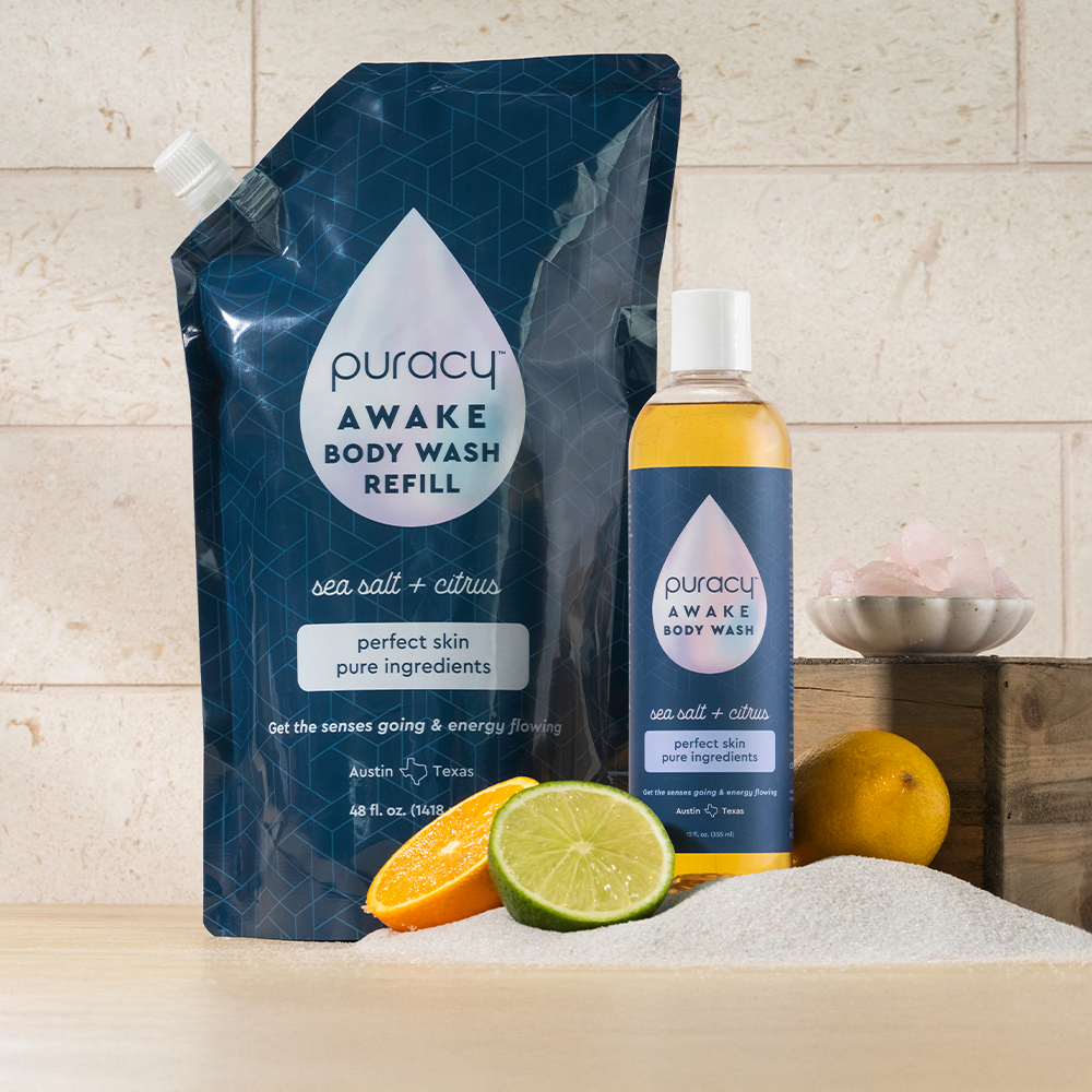 Puracy Body Wash (Acidified, PH Balanced) with citrus, bath salts, and coconut cleansers displayed.