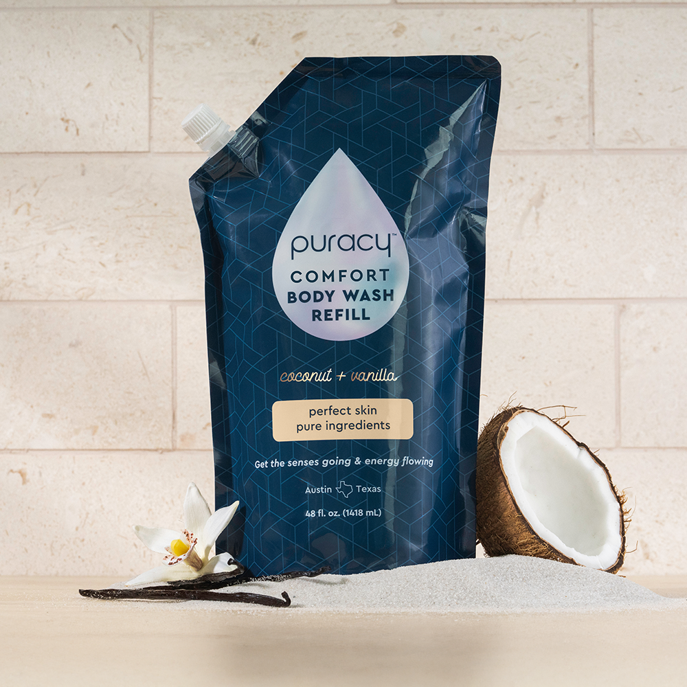 Body Wash (Acidified, PH Balanced) refill with coconut cleansers, vanilla flower, and sand backdrop.