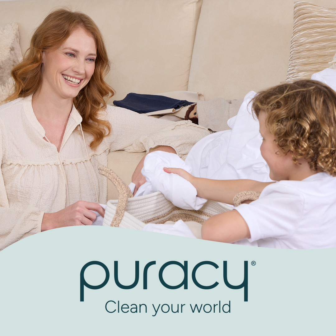 Smiling woman and child folding laundry, with Laundry Stain Remover Clean your world text below.