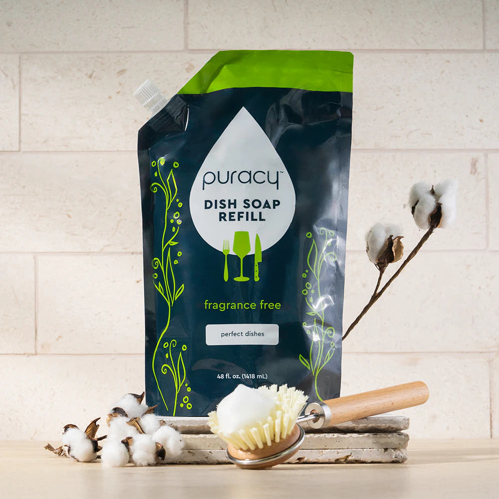 Eco-friendly Puracy Dish Soap refill with brush, cotton stems, and marble tray displayed.