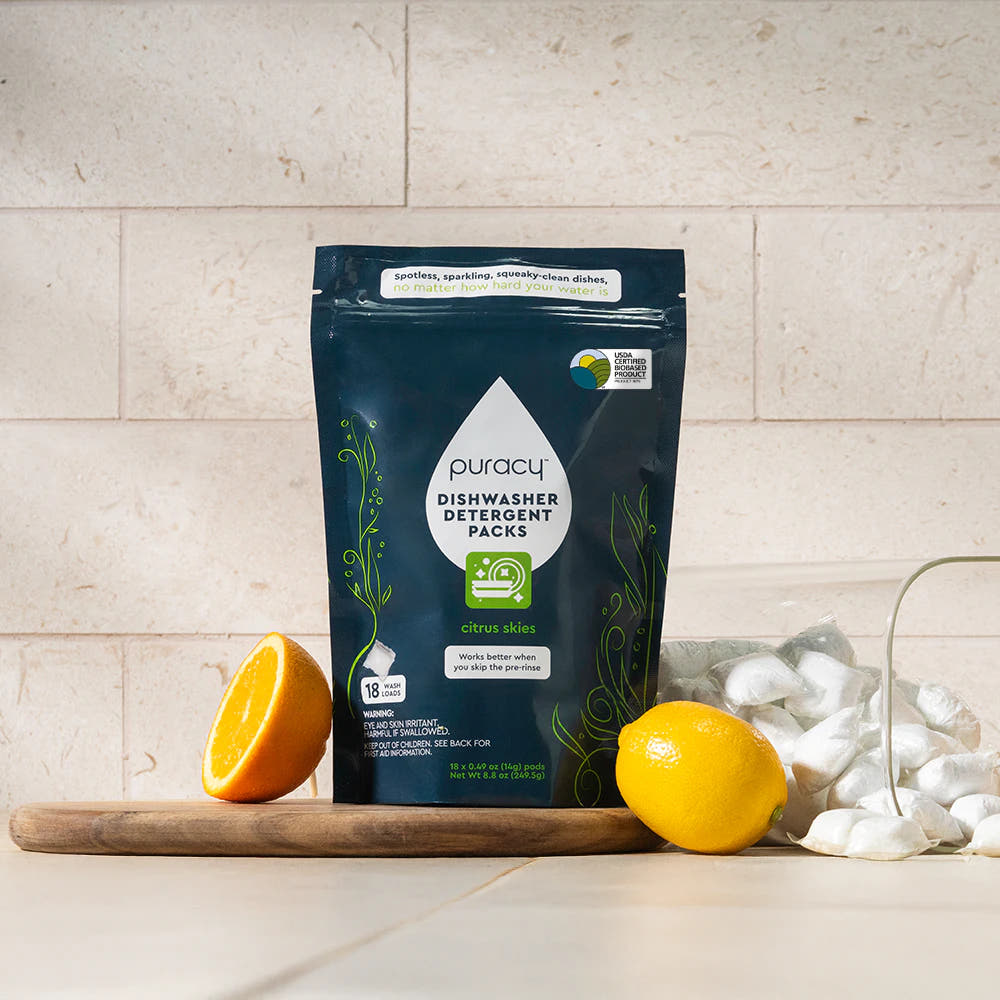 Dishwasher Detergent Pods with citrus scent and eco-friendly formula displayed on a wooden board.