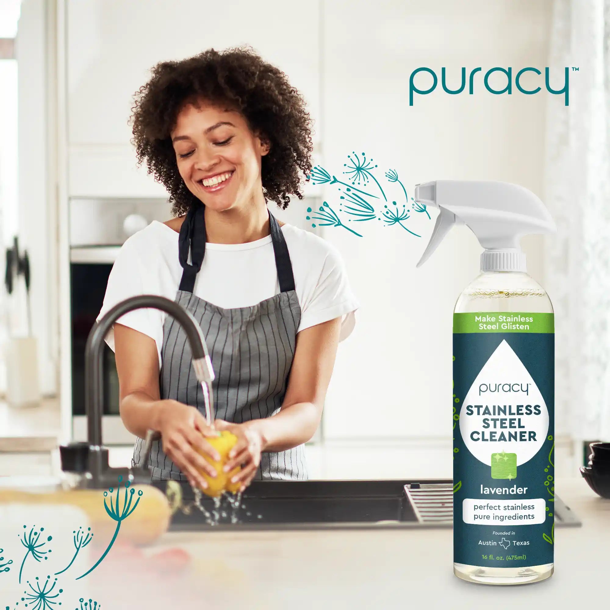 A woman smiles while washing dishes in the kitchen, a bottle of Stainless Steel Surface Cleaner with its plant-based formula catching the light beside her.