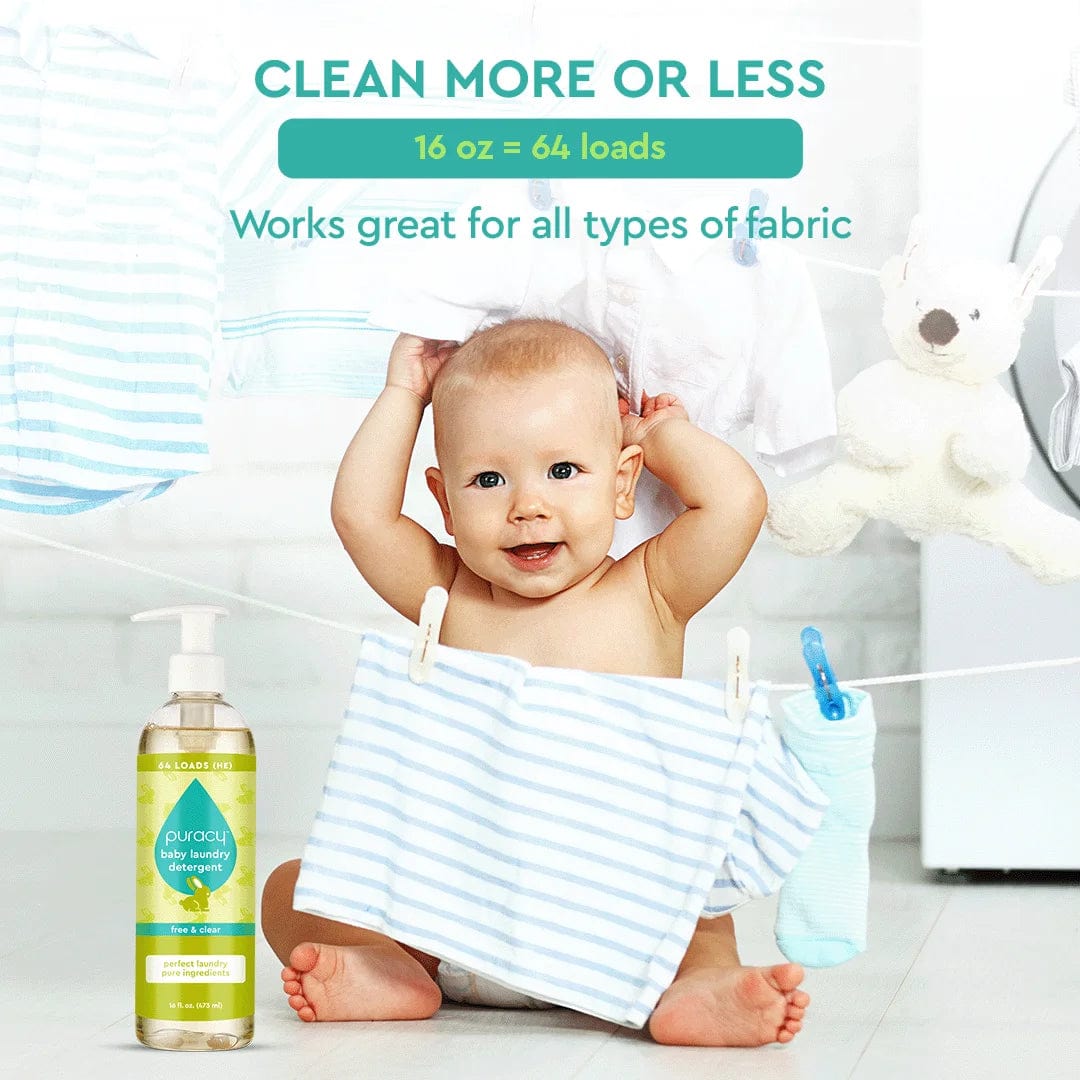 A baby sits amidst striped fabric, with a bottle of Baby Laundry Detergent nearby, surrounded by clothes drying on the line.