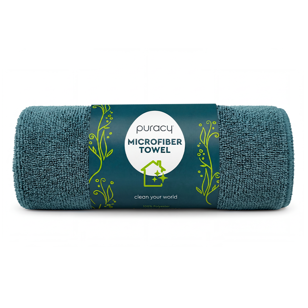 A rolled teal Micro-fibre Towel - Sample with a Puracy label and green decorative accents.