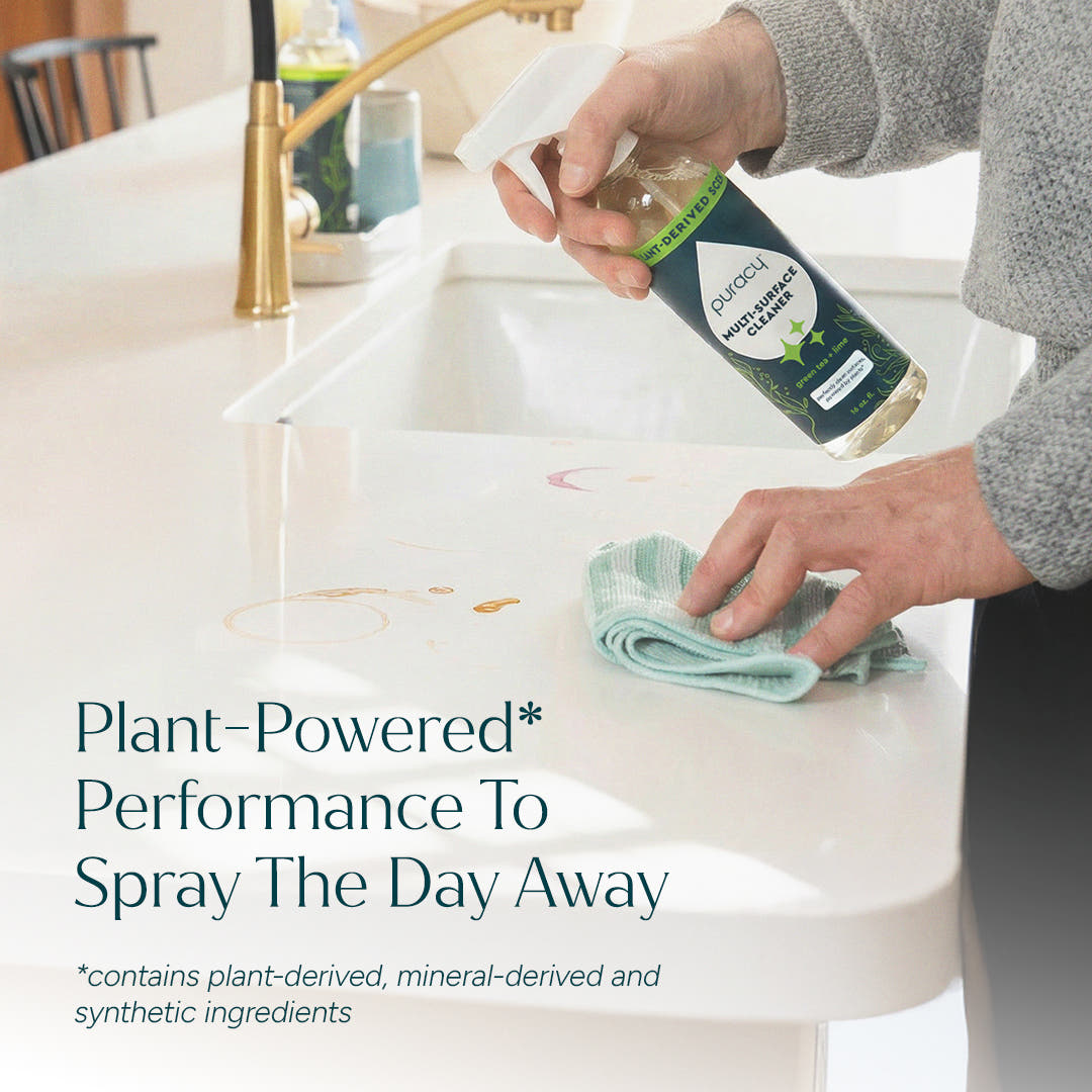 Person cleaning a white kitchen counter with Multi-Surface Cleaner Spray; text overlay near sink. #common