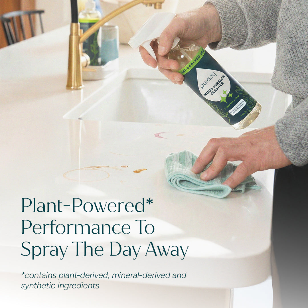 Person cleaning a white kitchen counter with Multi-Surface Cleaner Spray; text overlay near sink. #common