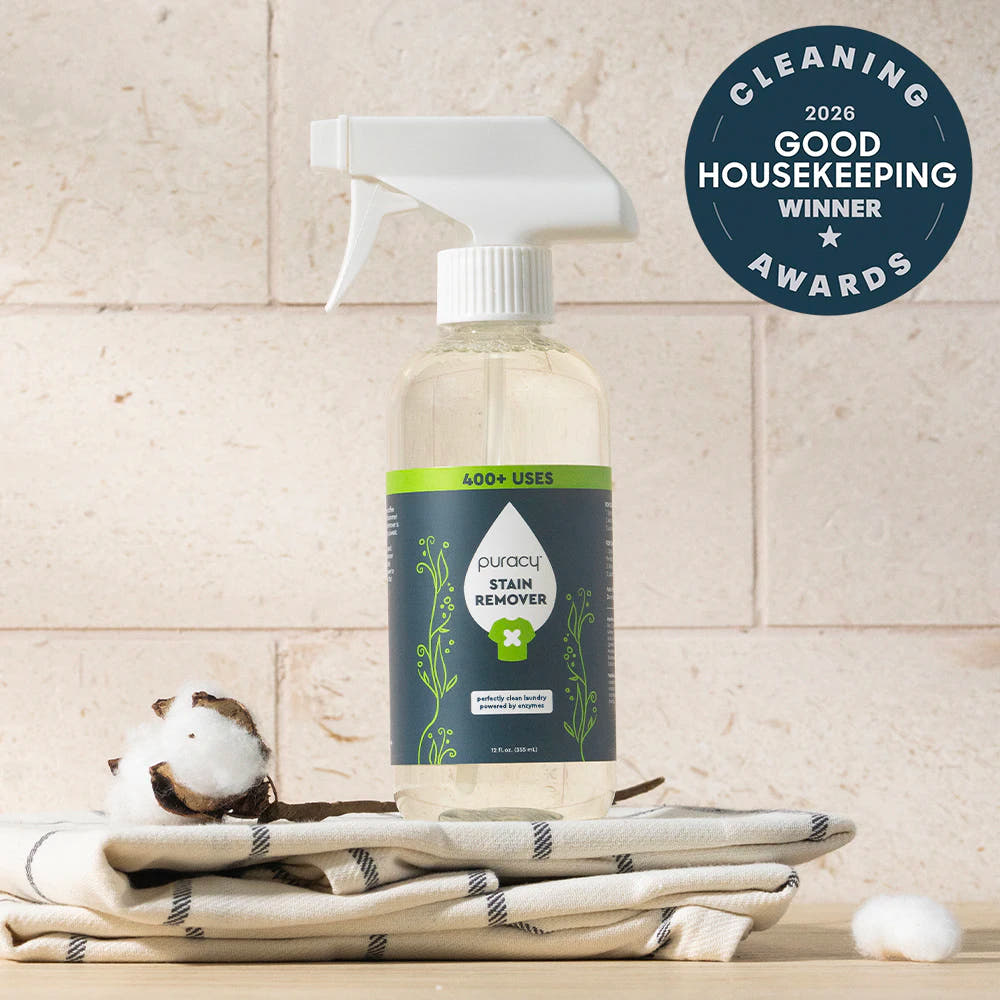 Laundry Stain Remover spray on cotton towels, featuring a 2026 Good Housekeeping award badge.
