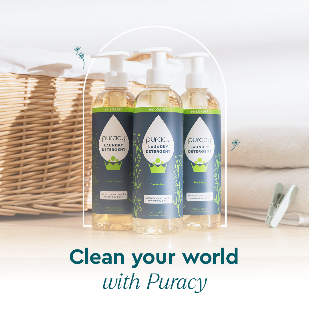 Three bottles of Laundry Detergent (Concentrated, Sulfate-Free) sit by towels, a basket, and a clothespin.