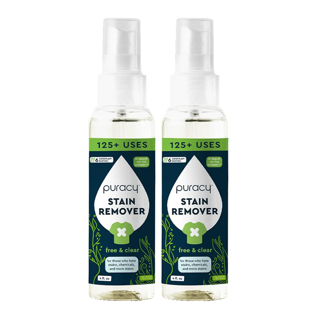 Two bottles of Puracy Laundry Stain Remover with spray tops and green labels