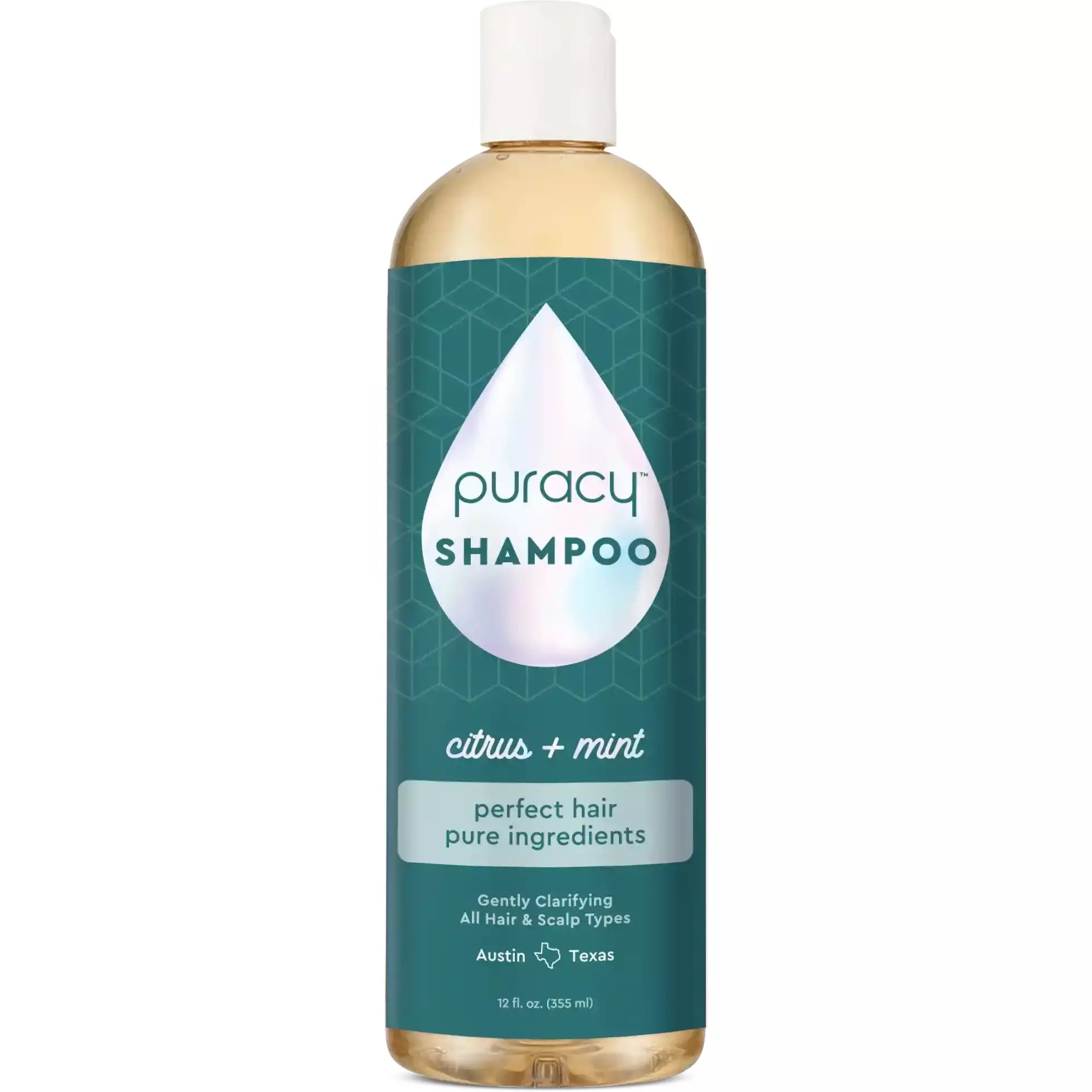 A bottle of sulfate, paraben, and silicone-free Puracy shampoo with a green label is enriched with citrus and mint botanical extracts and essential oils for a refreshing cleanse.