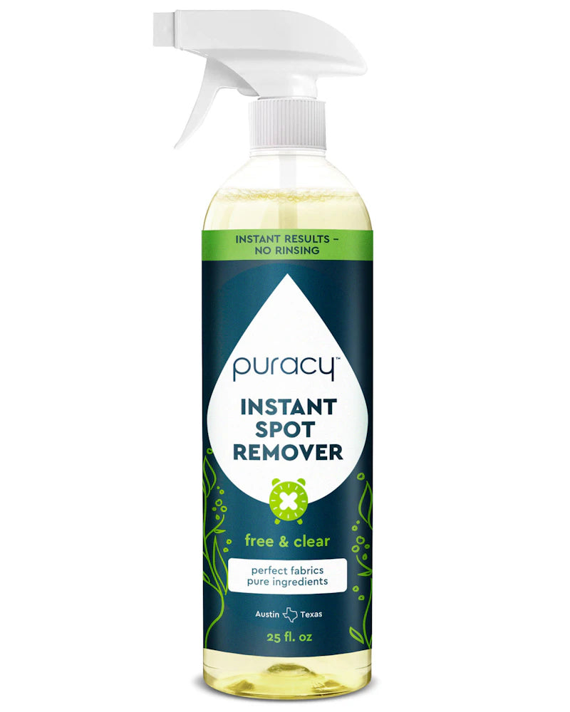 A bottle of Instant Spot Remover with a no-rinse formula and green plant-based accents.