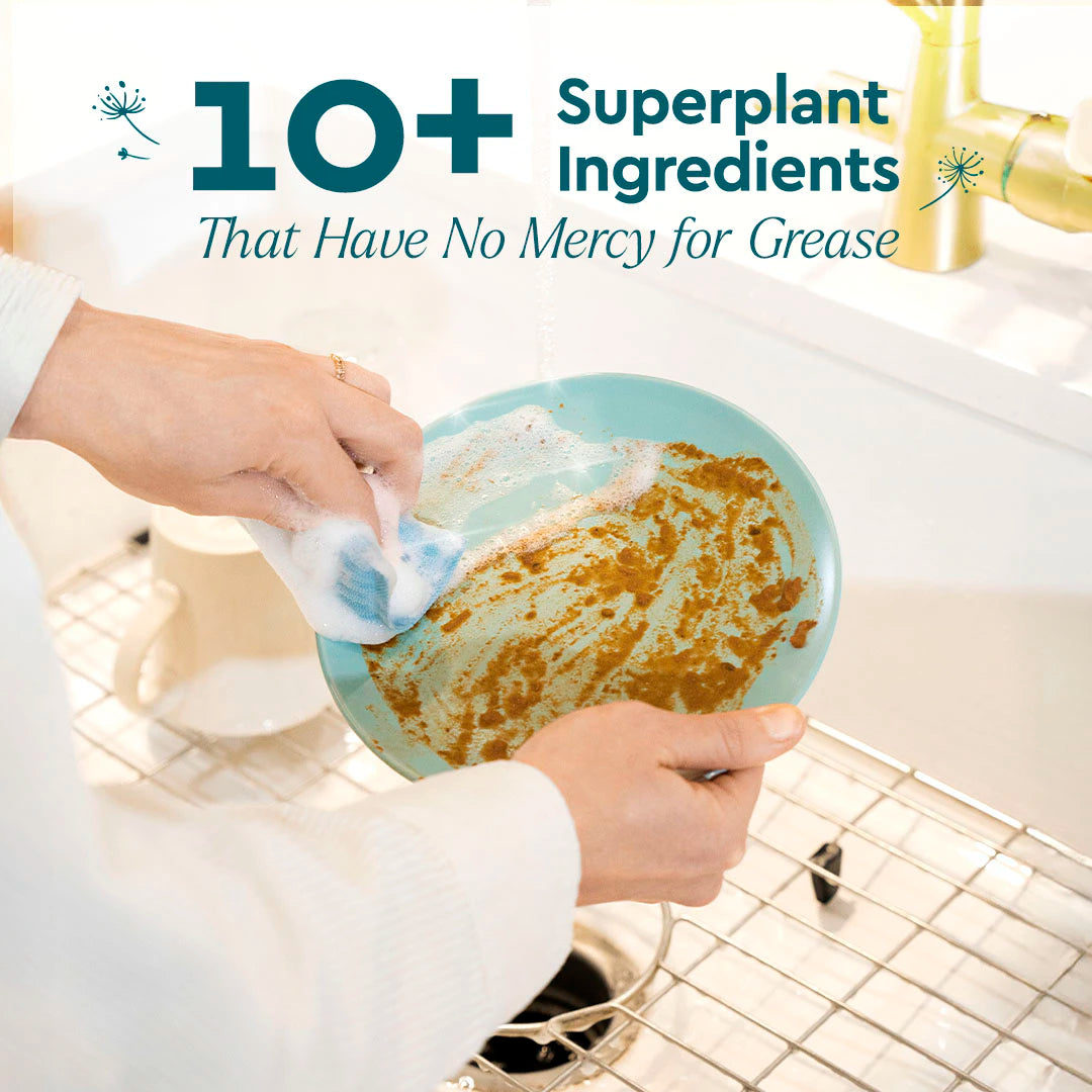 Person washing a greasy plate with Dish Soap, an eco-friendly, plant-based cleaner for tough grease.