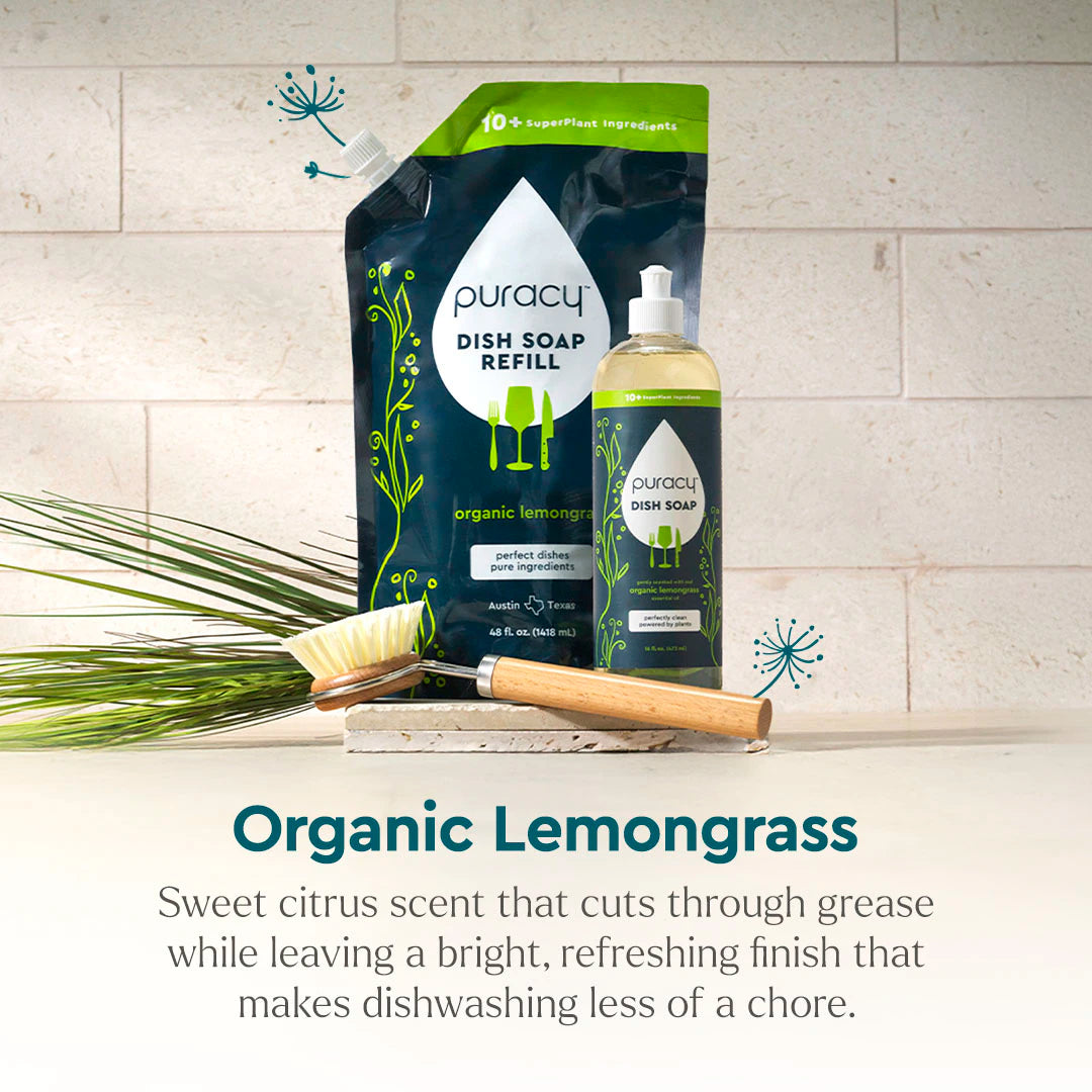 Puracy Dish Soap with refill, scrub brush, and greenery on a kitchen counter. #common #scent_organic-lemongrass