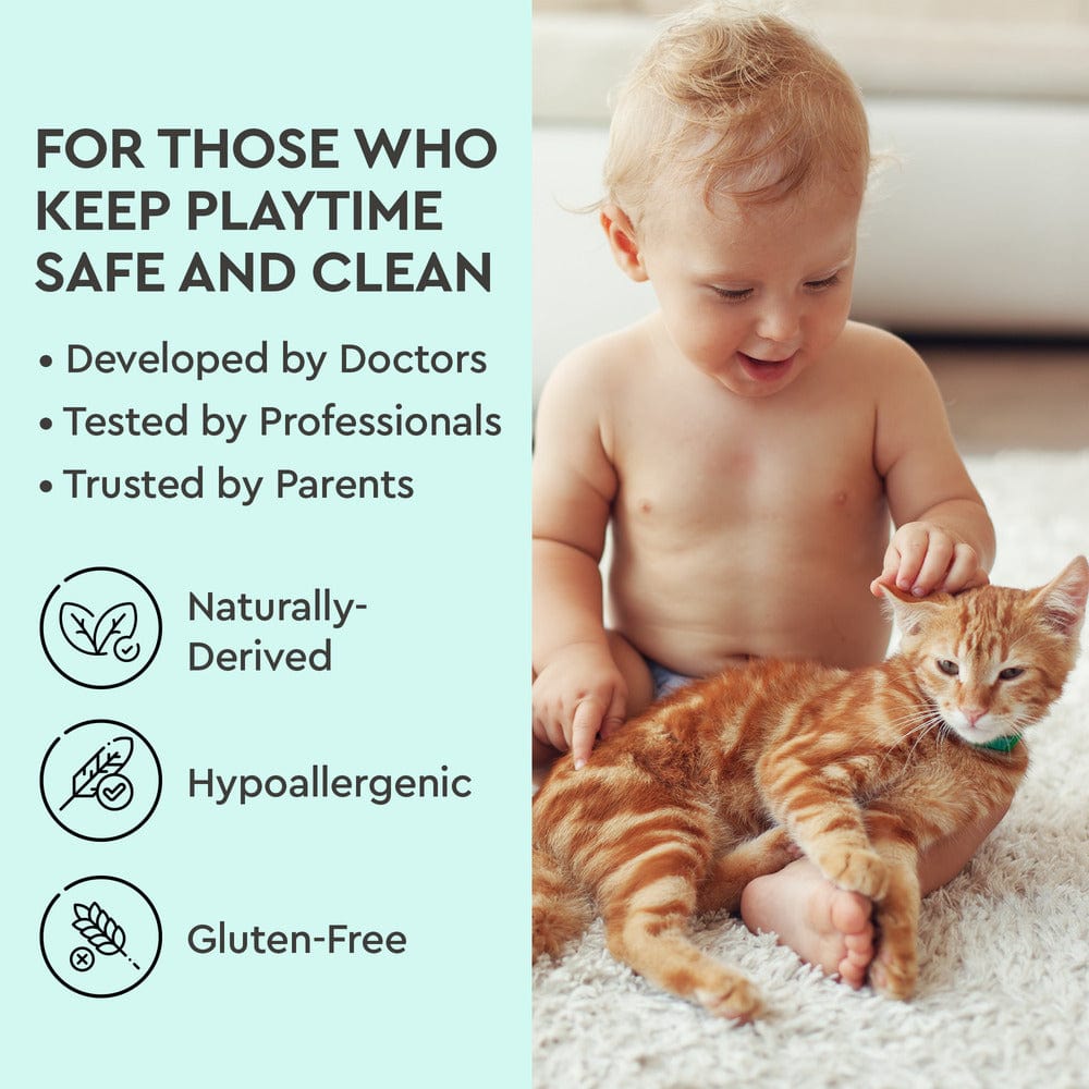 A toddler pets an orange cat beside text about Instant Spot Remover for plant-powered safe playtime.