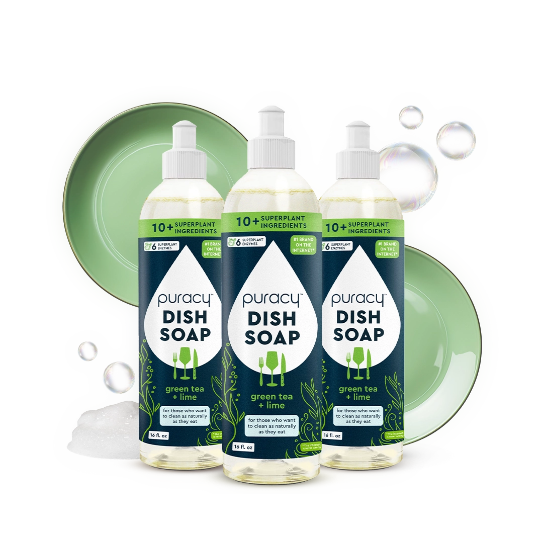 Three bottles of Puracy Dish Soap with green plates and bubbles in the background.