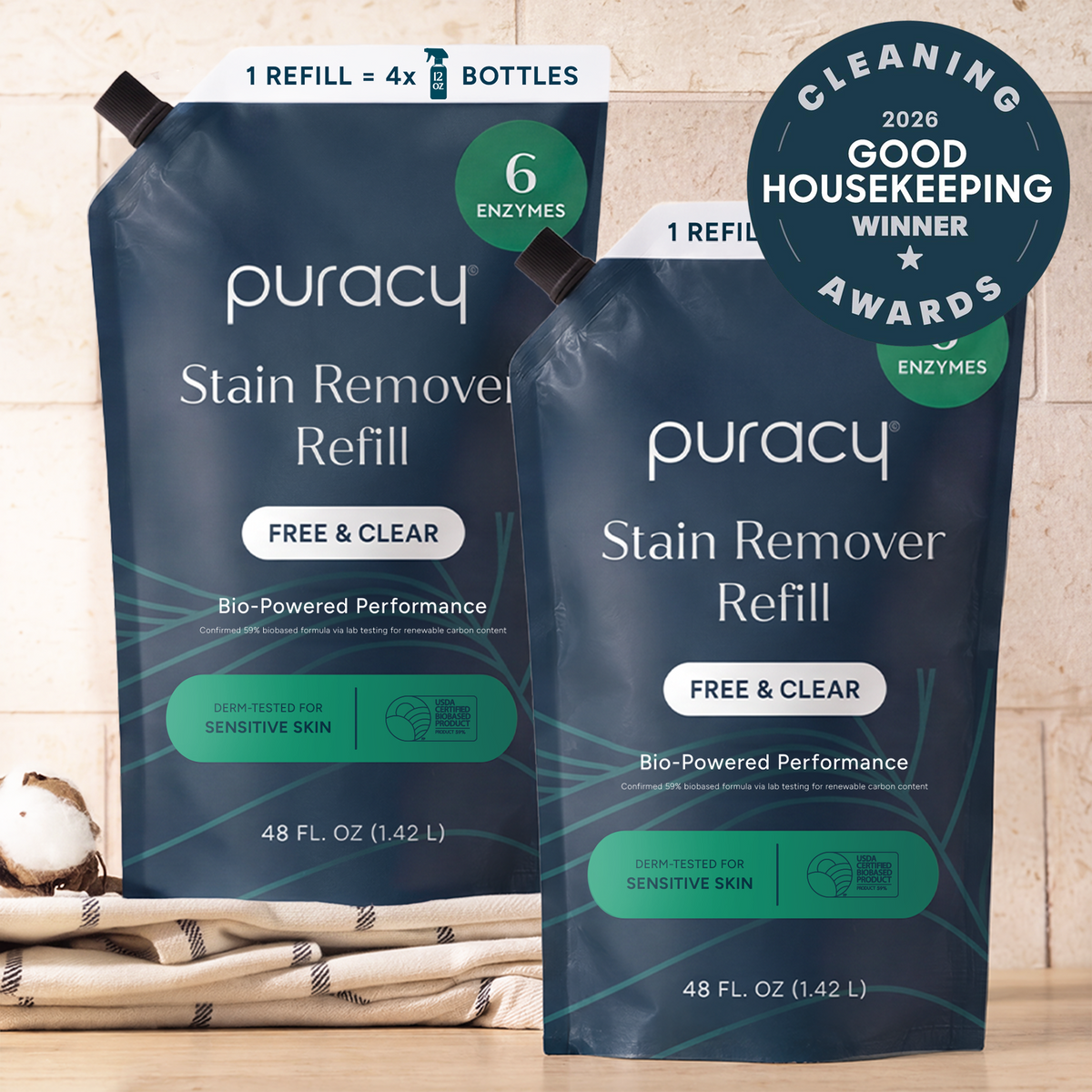 Two Laundry Stain Remover refill pouches on a counter, with an award badge in the corner.