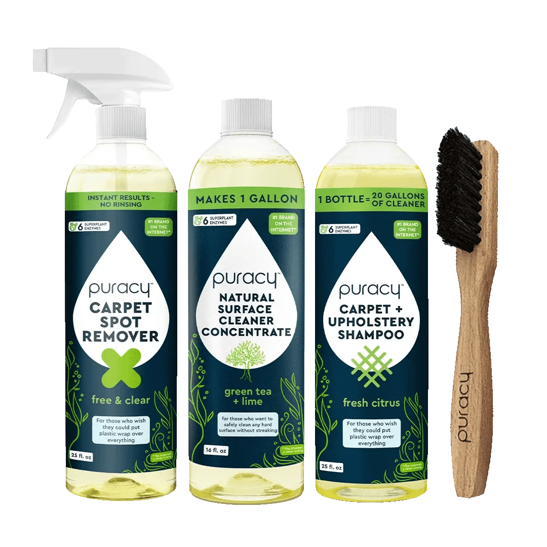 Puracy's Floor & Upholstery Bundle, ideal for furniture and floors, features a spray, two bottles, and a brush set against a green background. This collection ensures your home remains spotless and fresh.