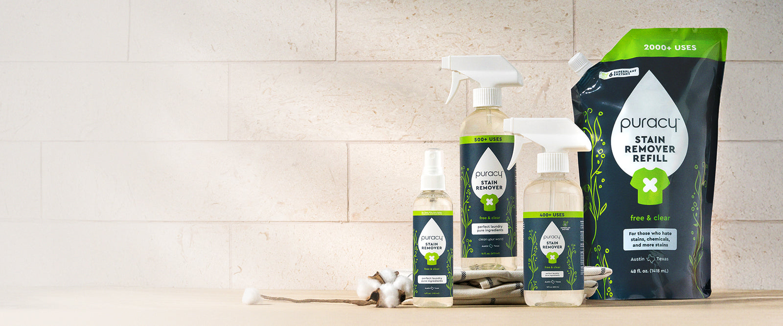 Puracy stain-fighting laundry products arranged across a lifestyle hero banner