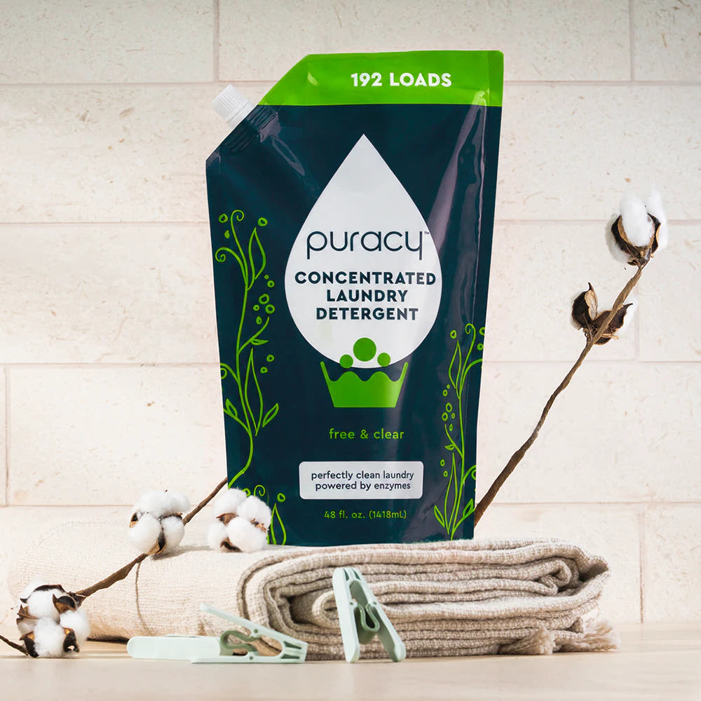 A Laundry Detergent (Concentrated, Sulfate-Free) pouch on towels, with stain-fighting enzymes.