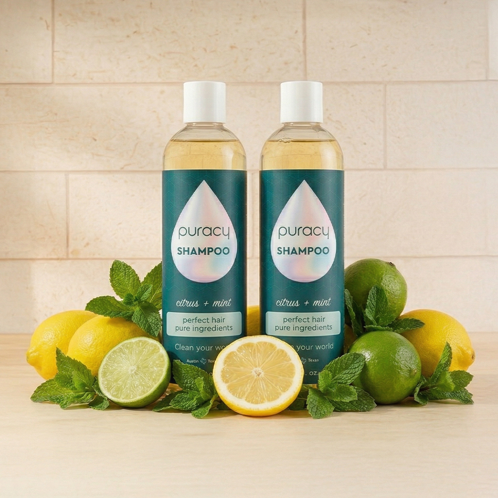 Two bottles of Shampoo (Sulfate/Paraben/Silicone-Free) with citrus and mint for frizz-free hair.
