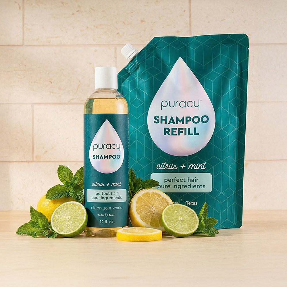 Shampoo (Sulfate/Paraben/Silicone-Free) and refill with citrus, mint, lime, and lemon slices on a counter.