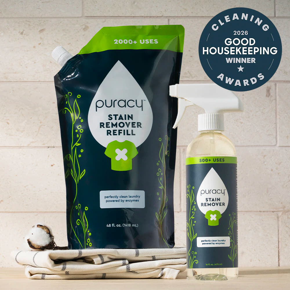 Laundry Stain Remover refill pouch and spray bottle on towel, Good Housekeeping award badge.