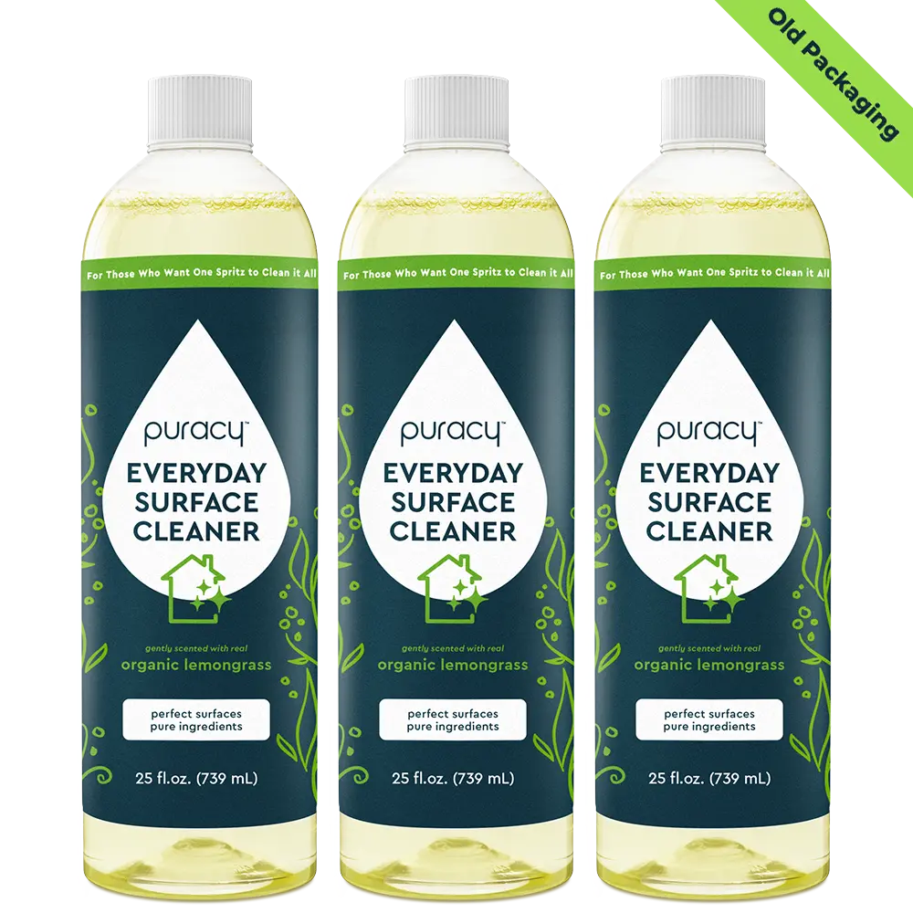 Three bottles of Everyday Multi-Surface Cleaner with organic lemongrass, labeled as old packaging. This eco-friendly choice offers versatile cleaning for your home.